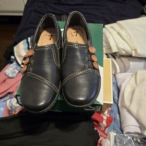 Clarks Black Leather Flats with Brown Accents